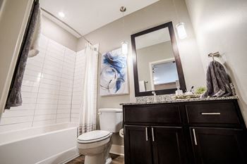 a bathroom with a shower and a toilet and a sink at The Foundry, Indiana